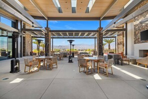Outdoor dining - Updated Condo w/ Large Patio, 80” TV, Garage & Access to Pools, Golf & Fitness (Rancho Mirage)