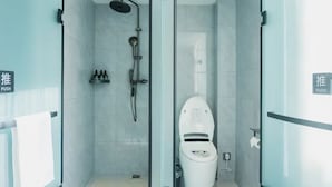 A modern bathroom with a glass partition, a shower, and a toilet. - Wodeexas College West Road Branch (Dezhou)