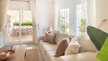Honeymoon Apartment, 2 Bedrooms, 2 Bathrooms, Mountainside (Los Naranjos de Marbella Luxury) | Living area | 21-inch flat-screen TV with cable channels, fireplace