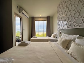 Family Triple Room, Sea View | In-room safe, desk, laptop workspace, soundproofing