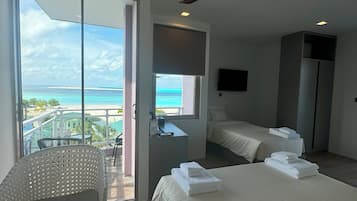 Family Triple Room, Sea View | In-room safe, desk, laptop workspace, soundproofing