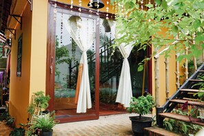 Family Room, 2 Queen Beds, Private Bathroom, Garden View | Terrace/patio