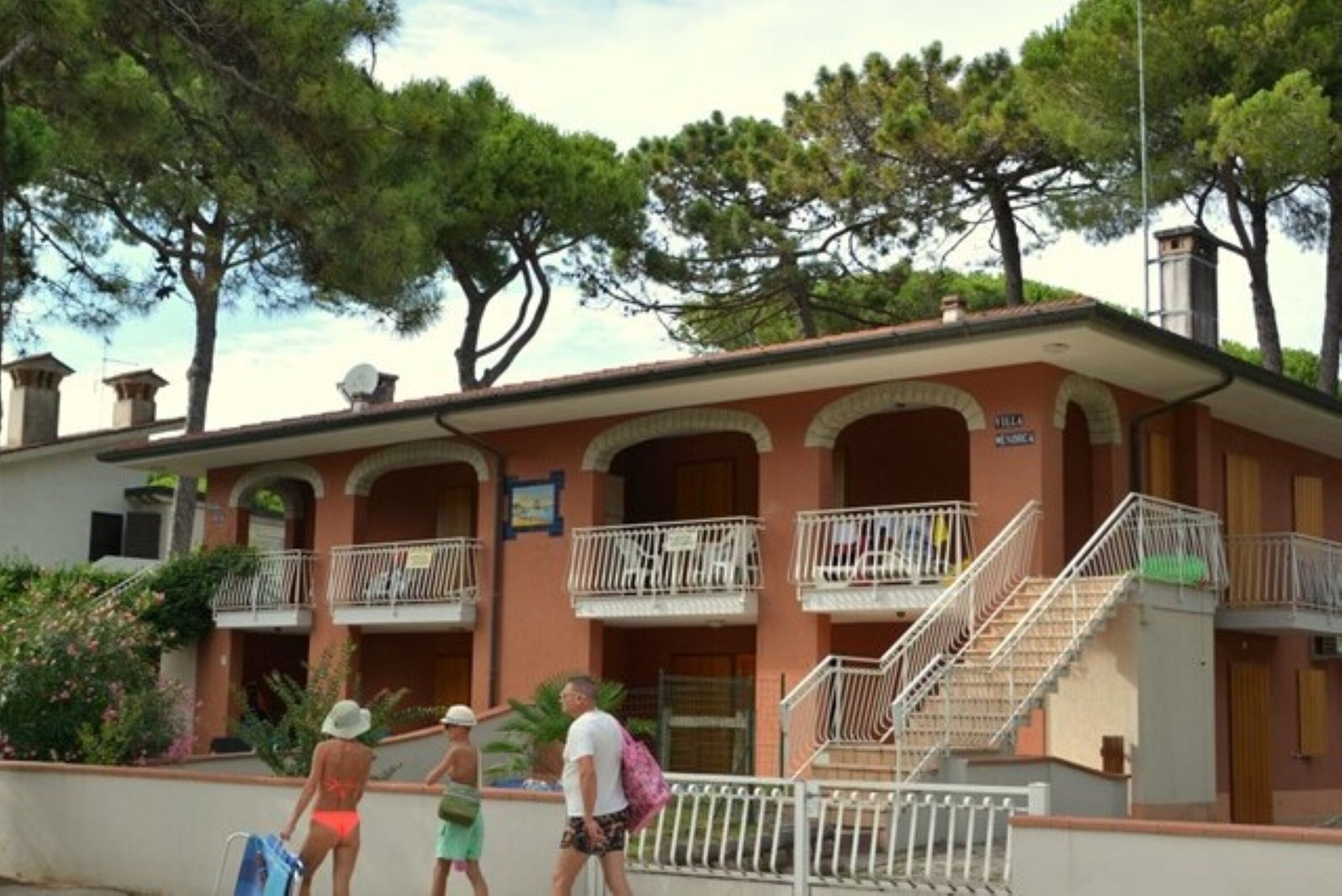 A building with multiple balconies and a staircase.