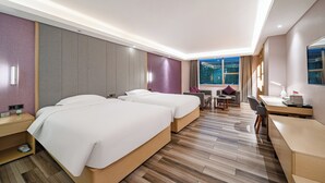 A hotel room with two beds, a desk, a chair, a small table, and a window with a view. - Echarm International Hotel Guangzhou Baiyun International Airport Huadu Plaza Branch - Free Deliver Service to Guangzhou Baiyun International Airport & Free Deliver Service to Canton Fair Complex During Canton Fair Period (Guangzhou)