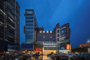 Front of property – evening/night - Echarm International Hotel Guangzhou Baiyun International Airport Huadu Plaza Branch - Free Deliver Service to Guangzhou Baiyun International Airport & Free Deliver Service to Canton Fair Complex During Canton Fair Period (Guangzhou)