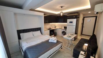 1 dormitori, planxa i posts de planxar i wifi