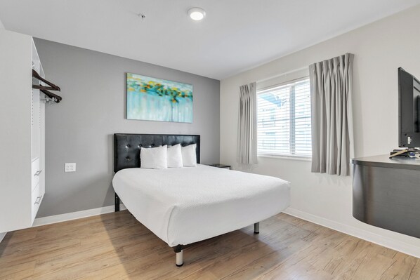 1 bedroom, desk, iron/ironing board, travel crib