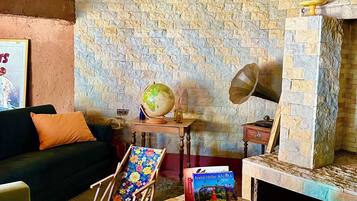 Fireplace, books, stereo, computer monitors