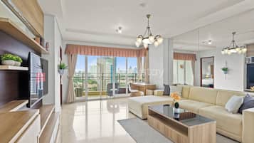 Apartment, 3 Bedrooms, City View | Living area | Flat-screen TV