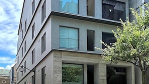 A multi-story hotel with a modern design, featuring large windows and a flat facade. - KyotoABizhotel (Kyoto)