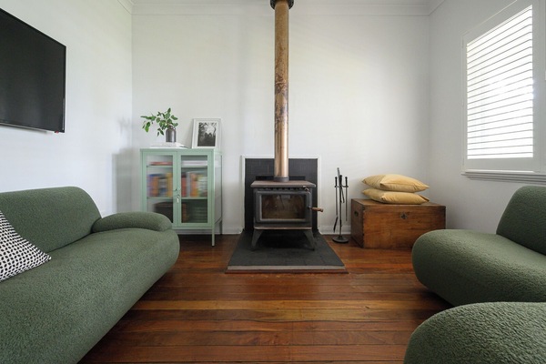 Cosy living room with comfortable couches and fire place