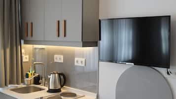 Mini-fridge, stovetop, coffee/tea maker, electric kettle