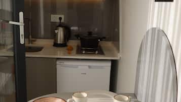Mini-fridge, stovetop, coffee/tea maker, electric kettle
