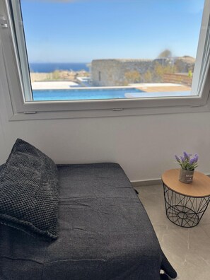 Two-Bedroom Apartment | Living area | 44-inch TV with satellite channels - Psaros Village (Mykonos)