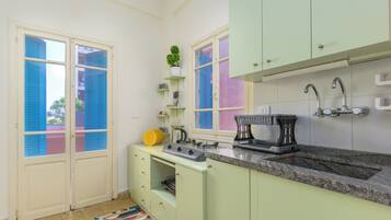 Fridge, stovetop, electric kettle, cookware/dishes/utensils