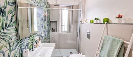 Shower, hair dryer, towels, soap