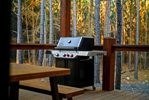 Enjoy al fresco dining on the deck, where a portable grill and picnic table await.