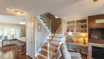 A staircase with white balusters and wooden steps leading to a landing.