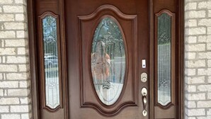 A brown double door with glass panels and a keyhole. - Beautiful Room Just Waiting for You Pool IS Closed (Etowah)