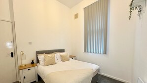 Apartemen | 2 kamar tidur, setrika/meja setrika, Wi-Fi gratis, dan seprai linen