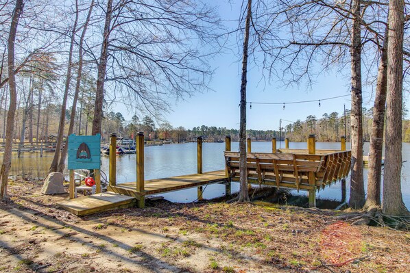 A wooden dock extending into a lake, surrounded by trees. - Private Dock, Fire Pit: Lake Murray Family Escape! (Leesville)