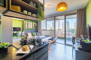 A modern apartment with a kitchen, dining area, and a balcony with a city view. - VN MELO ALVES (Sao Paulo)