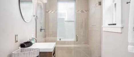 Shower, hair dryer, towels, soap