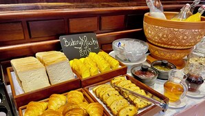 A bakery display with various pastries and bread. - Bronam Residence & Spa (Siem Reap)