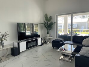 TV, fireplace, books, printers