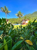 Quarto triplo conforto, vista para o jardim | Vista para o jardim
