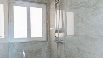 Shower, hair dryer, towels
