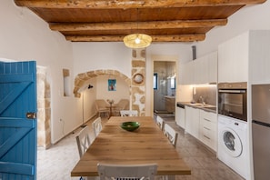 Enjoy cooking and dining in this well-equipped kitchen with a central island and dining area.