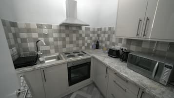 Apartment | Private kitchen | Fridge, microwave, oven, stovetop