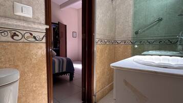 Shower, towels, soap, toilet paper