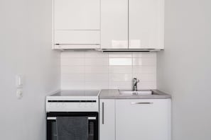Private kitchen - Modern Studio Apartment in Lönnrotinkatu (Helsinki)