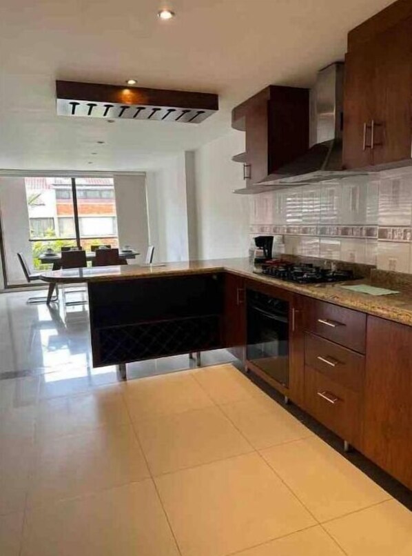 Fridge, coffee/tea maker, cookware/dishes/utensils