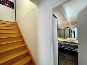 A staircase leading to a bathroom with a white sink and storage drawers. - Villa with pool + fantastic terraces A3699 (Lège-Cap-Ferret)