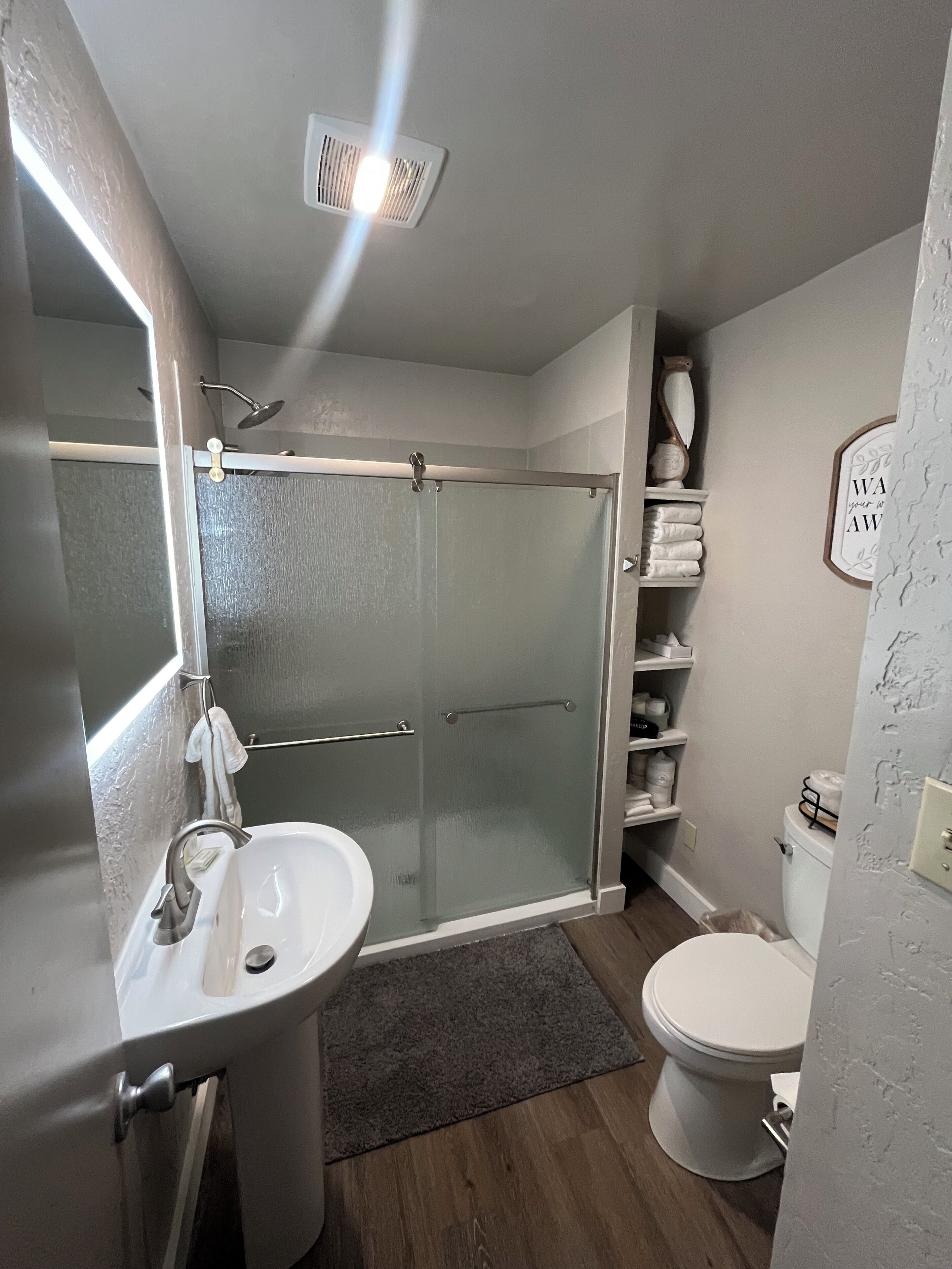 Shower, hair dryer, towels, soap