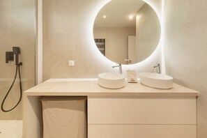 Shower, hair dryer, towels, toilet paper