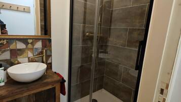 Shower, hair dryer, towels, toilet paper