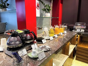 A breakfast buffet with various beverages and dishes, including coffee, tea, and milk. - Azumaya Hotel Dao Tan (Hanoi)