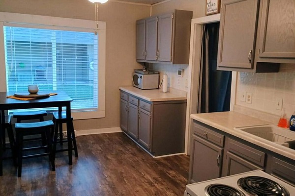 View of the kitchen with dining room table.