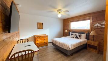 1 bedroom, desk, iron/ironing board, travel crib