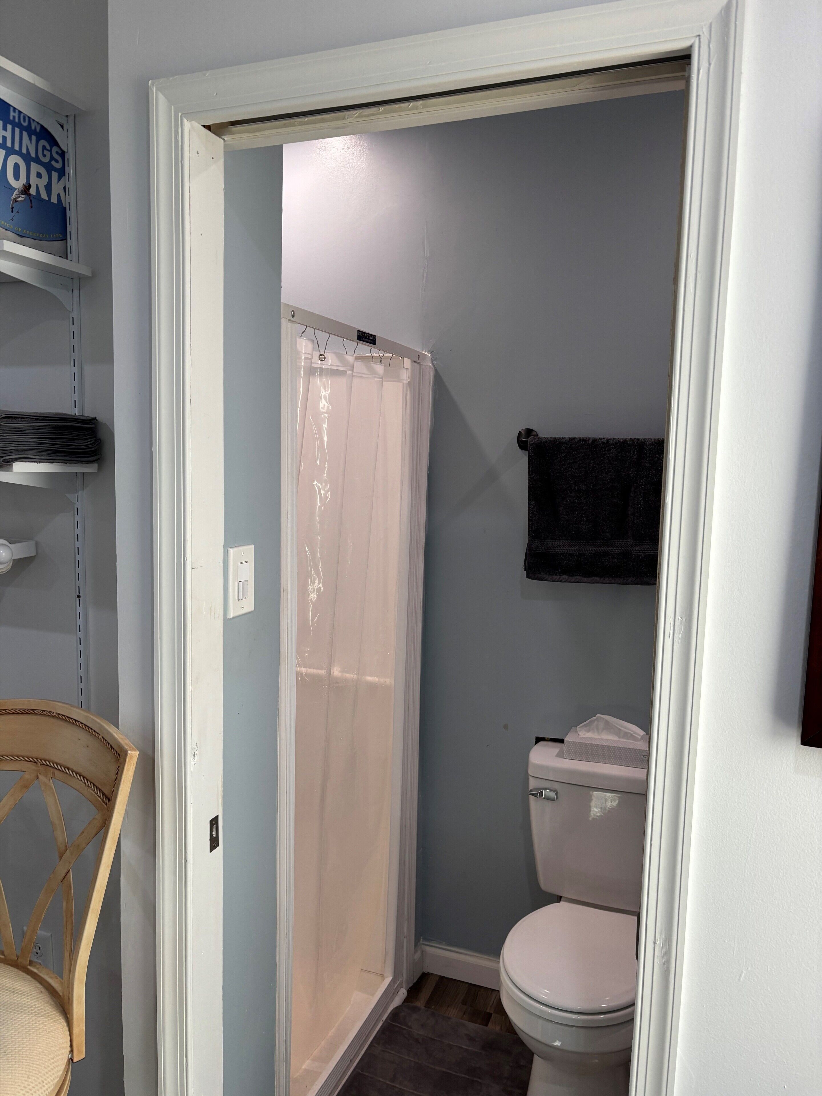 Shower, hair dryer, towels, toilet paper