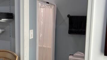 Shower, hair dryer, towels, toilet paper