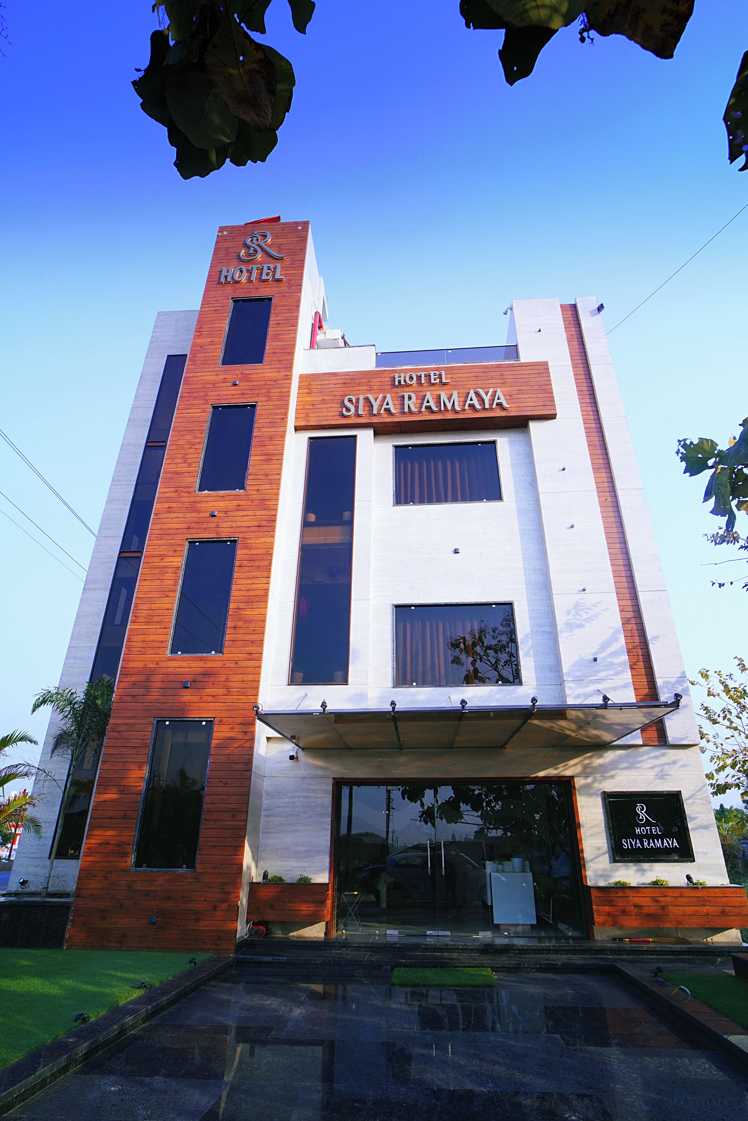 A modern hotel with a prominent sign reading "Siyaramaya Hotel".