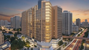 A modern high-rise hotel with a grid-like facade, surrounded by a well-maintained urban environment. - KINCO Hotel (Huizhou Huiyang Station) (Huizhou)