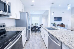 Microwave, oven, stovetop, dishwasher - Stay, Splash & Unwind – Poolside 2BR Condo with Hot Tub, Pickleball & BBQ Grills (Port Aransas)