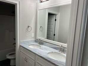 Jetted tub, hair dryer, towels, soap