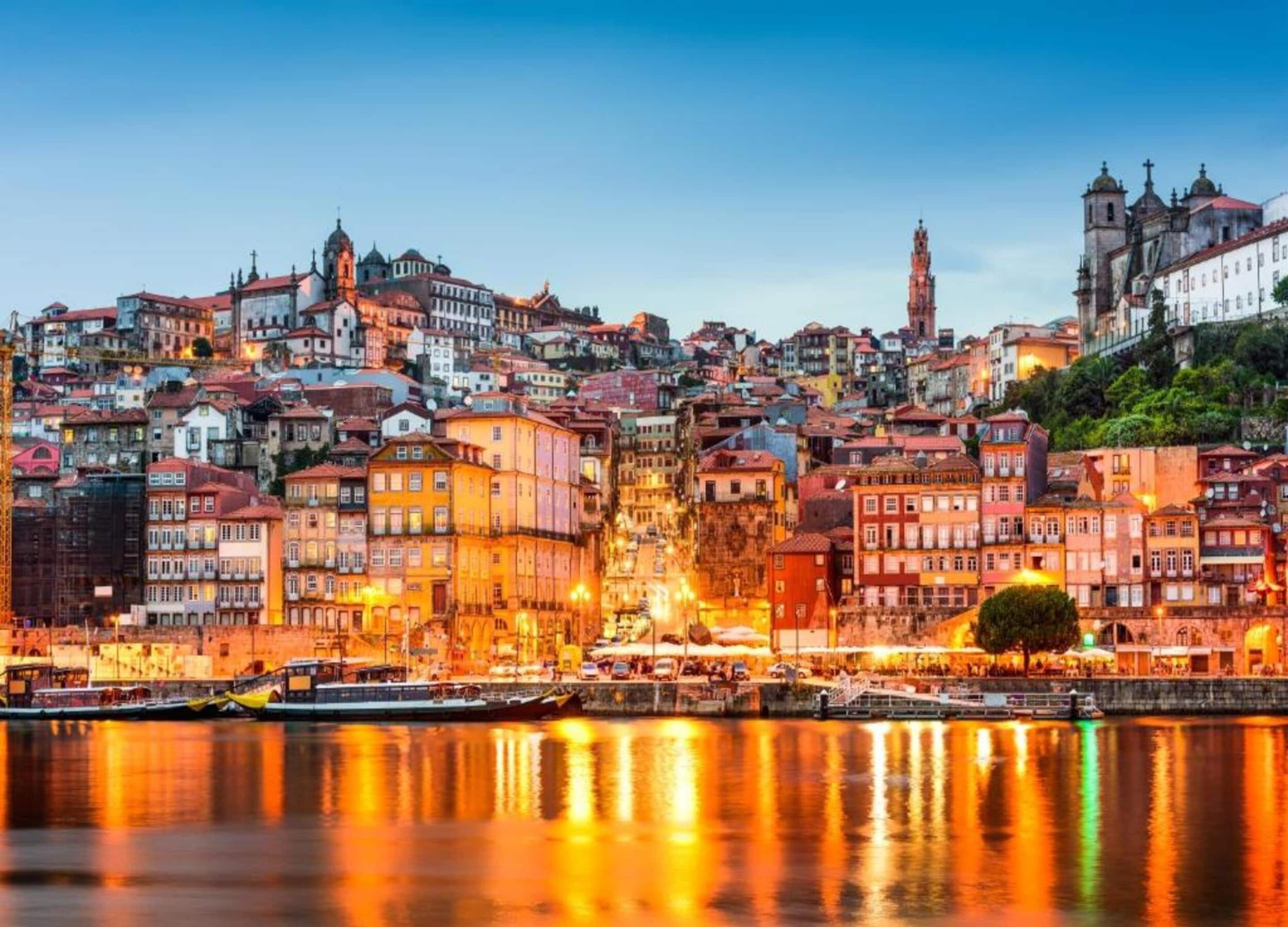 A cityscape with historic buildings along a waterfront.